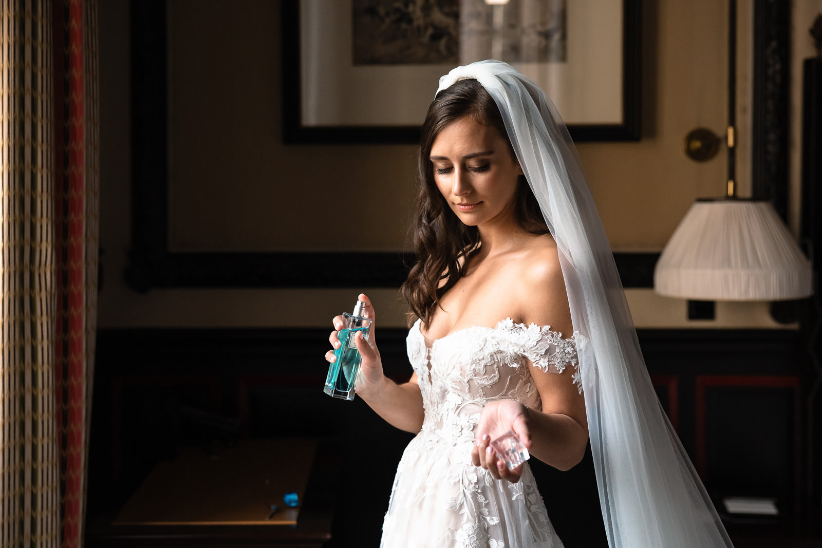 Bride puts on her perfume Intimate Beach Wedding Photographer