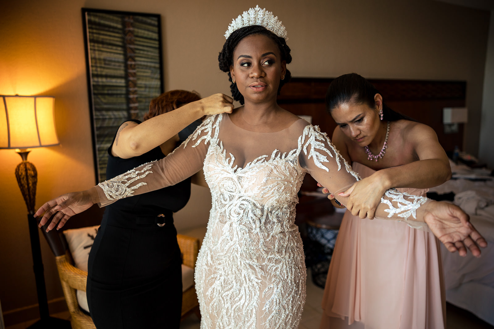 Destination wedding photographer Panama Bride putting on wedding dress
