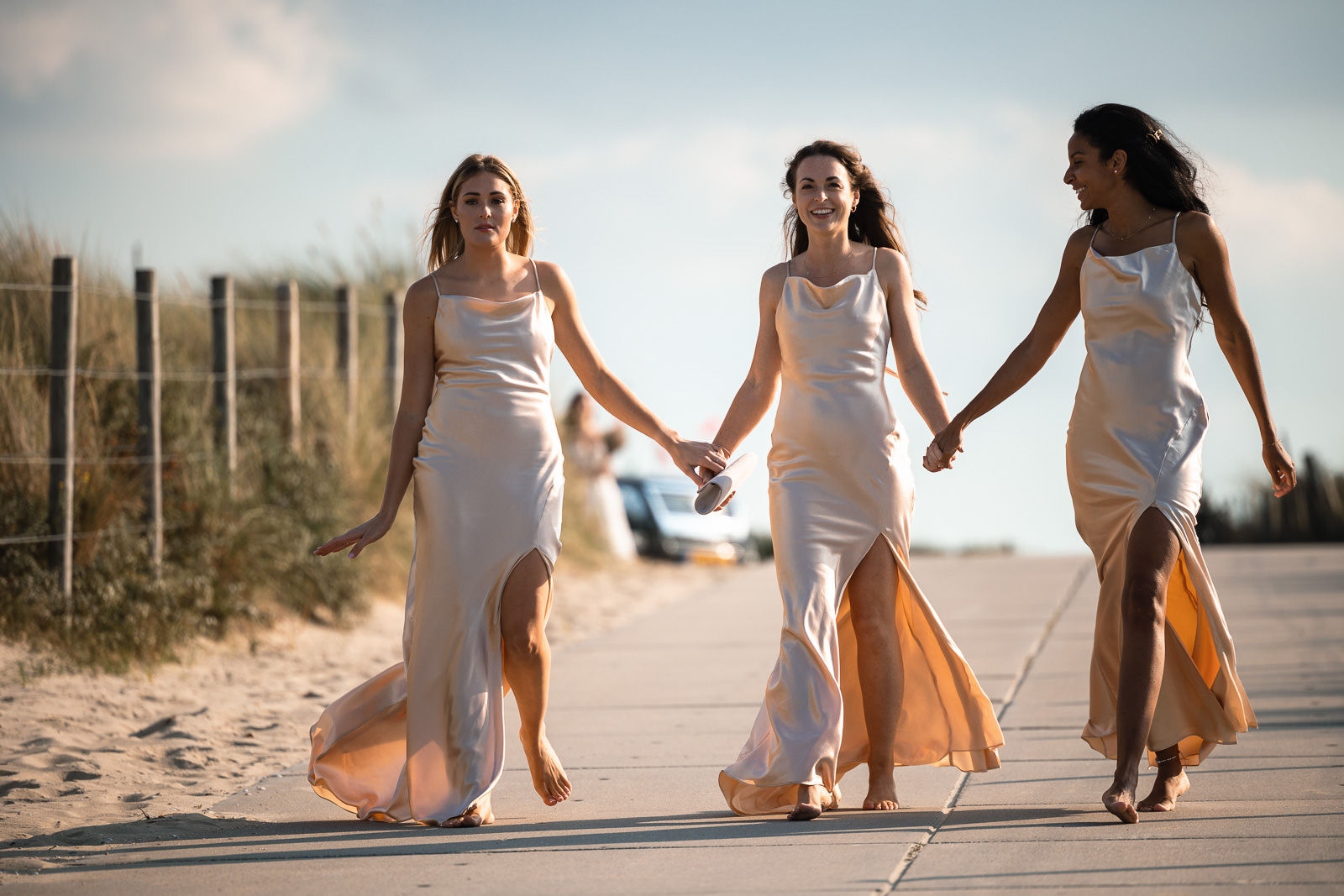 Bridesmaids walk down to ceremony for Intimate Beach Wedding Photographer