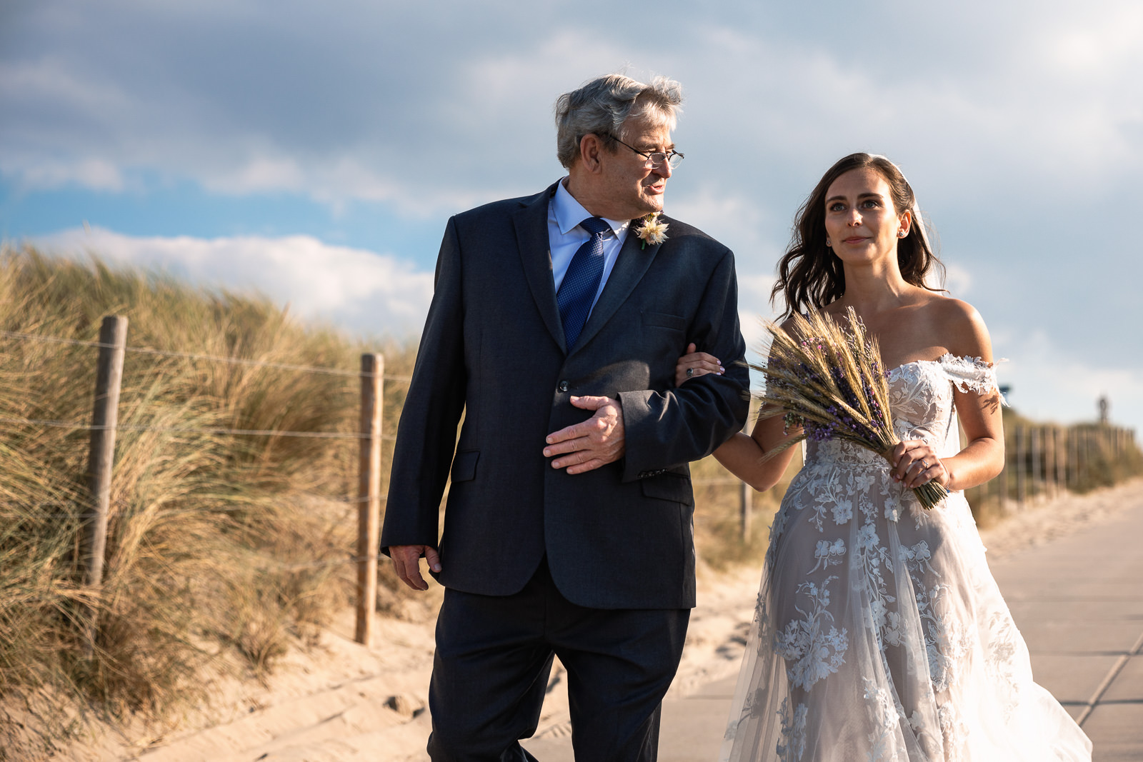 Proud dad walks his daughter to the ceremony of Intimate Beach Wedding Photographer