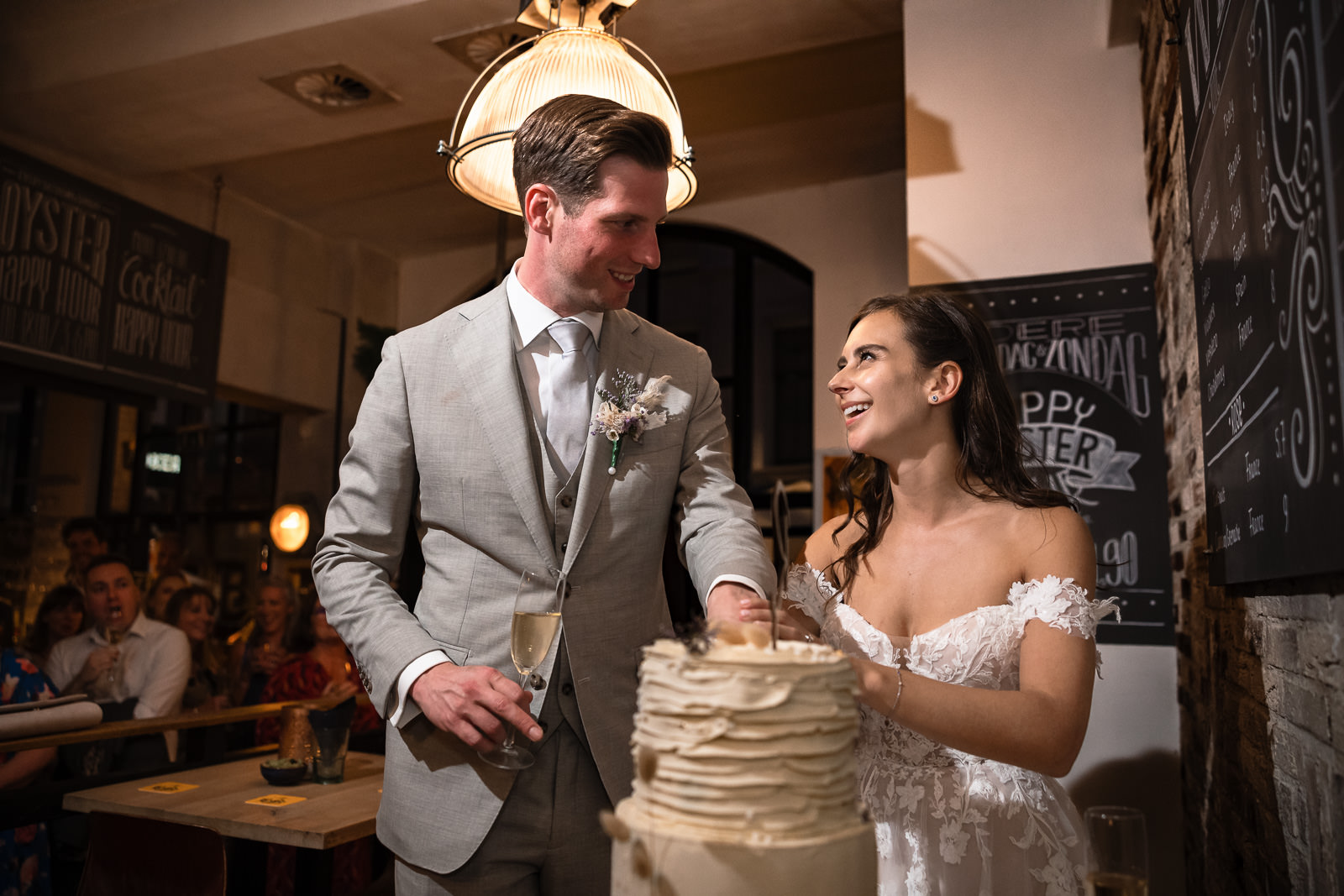 Bride and groom cake cutting at Oker