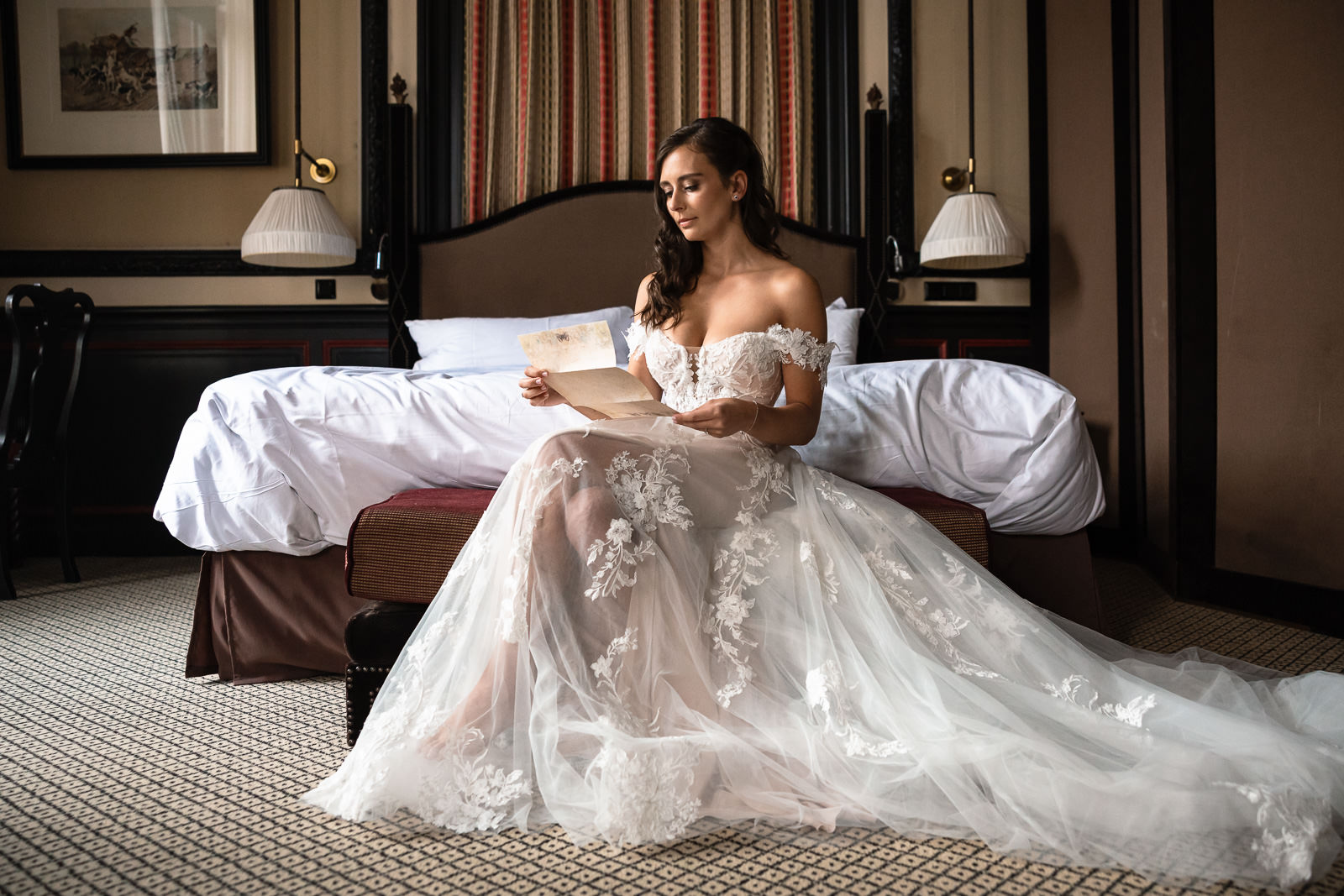 Bride reads letter from groom during bride prep Intimate Beach Wedding Photographer