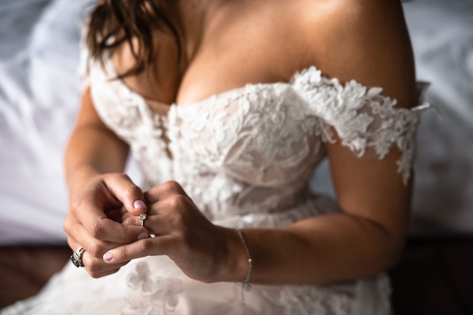 Bride plays with engagement ring Intimate Beach Wedding Photographer