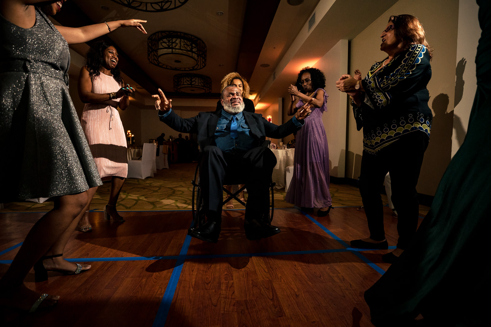 Destination wedding photographer Panama even uncle in wheelchair on the dance floor