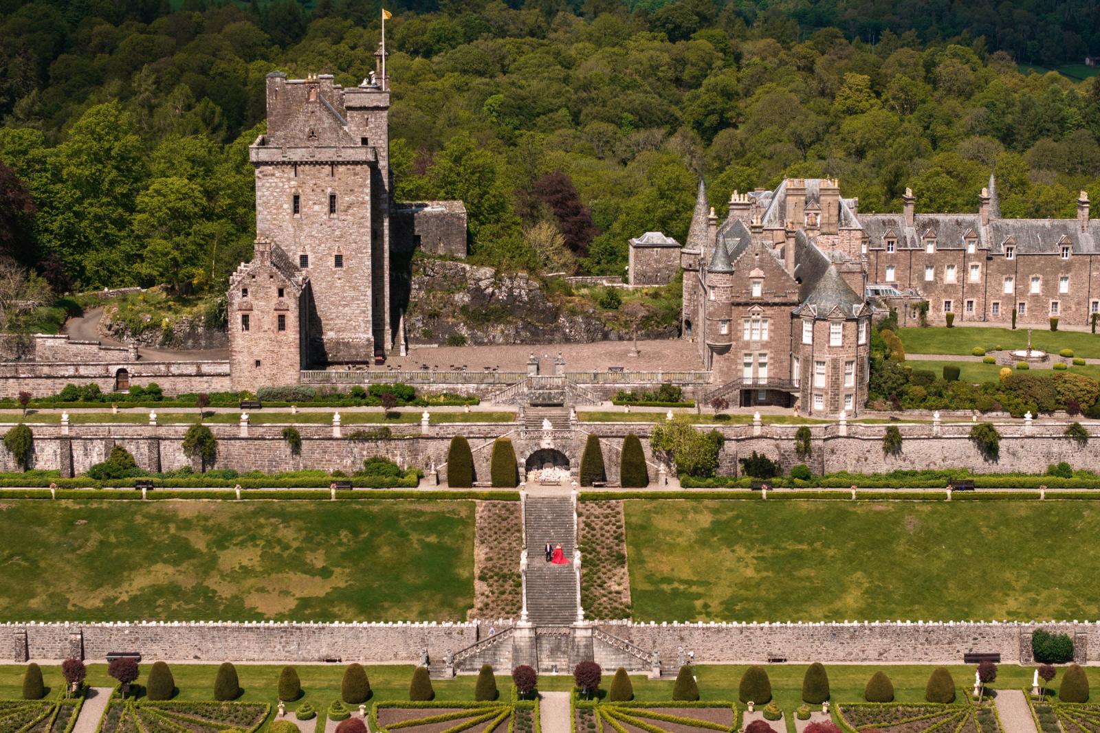 High angle overview of the Scottish castle and its terraced gardens during a pre-wedding shoot