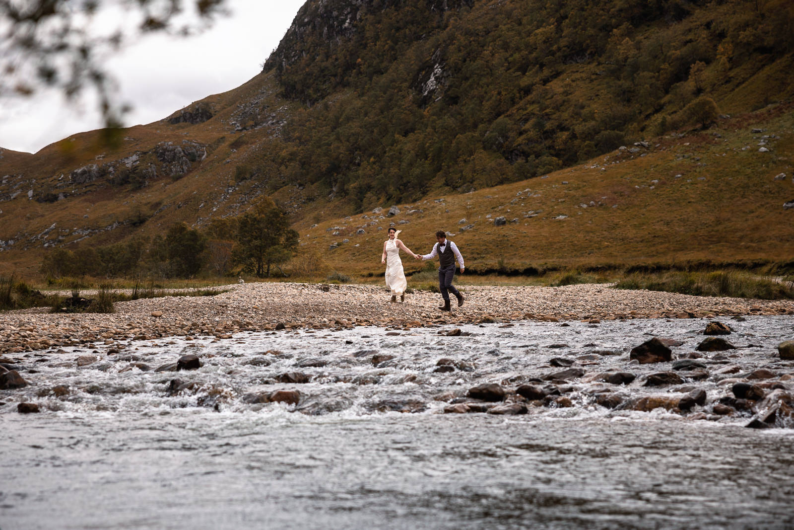 Eloping in Highlands Scotland by river with Wedding Photographer