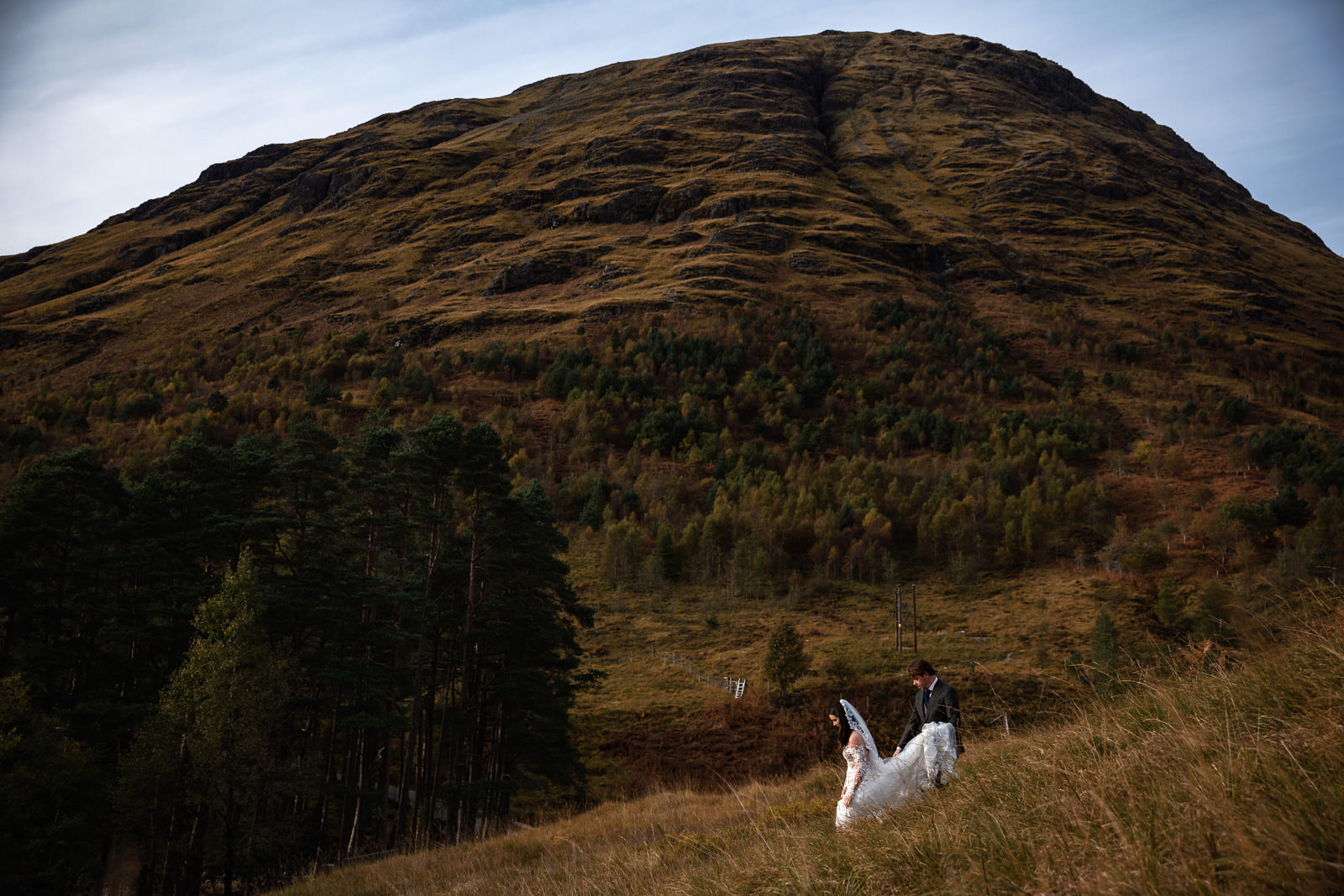 Highlands Wedding Photographer Scotland couple walking on a mountain