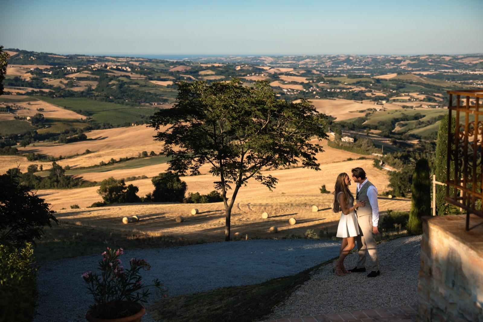 Bride Gemmy and groom Niels embracing during golden hour at Le Stonghe countryside venue