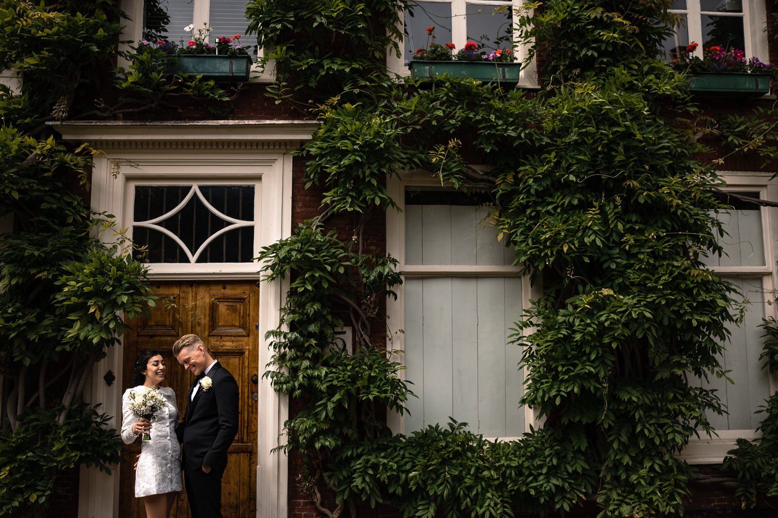 Bride and groom at a beautiful old house with plants Wedding photographer The Hague 