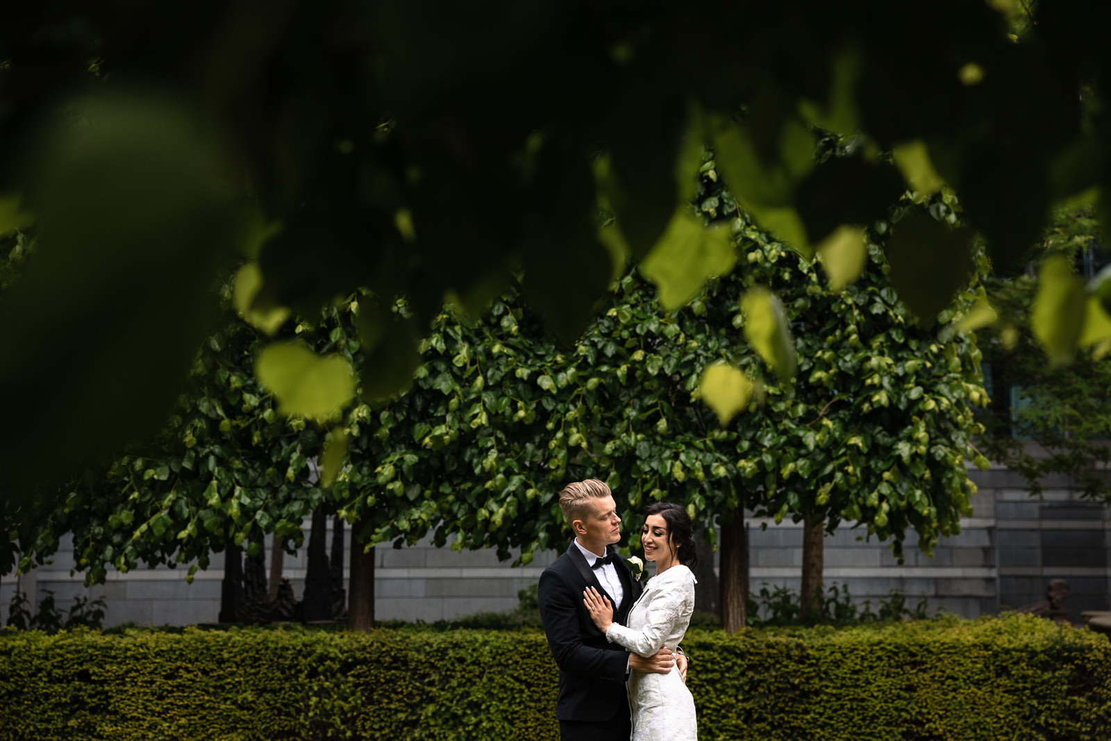 bride and groom in a hidden garden Wedding photographer The Hague 