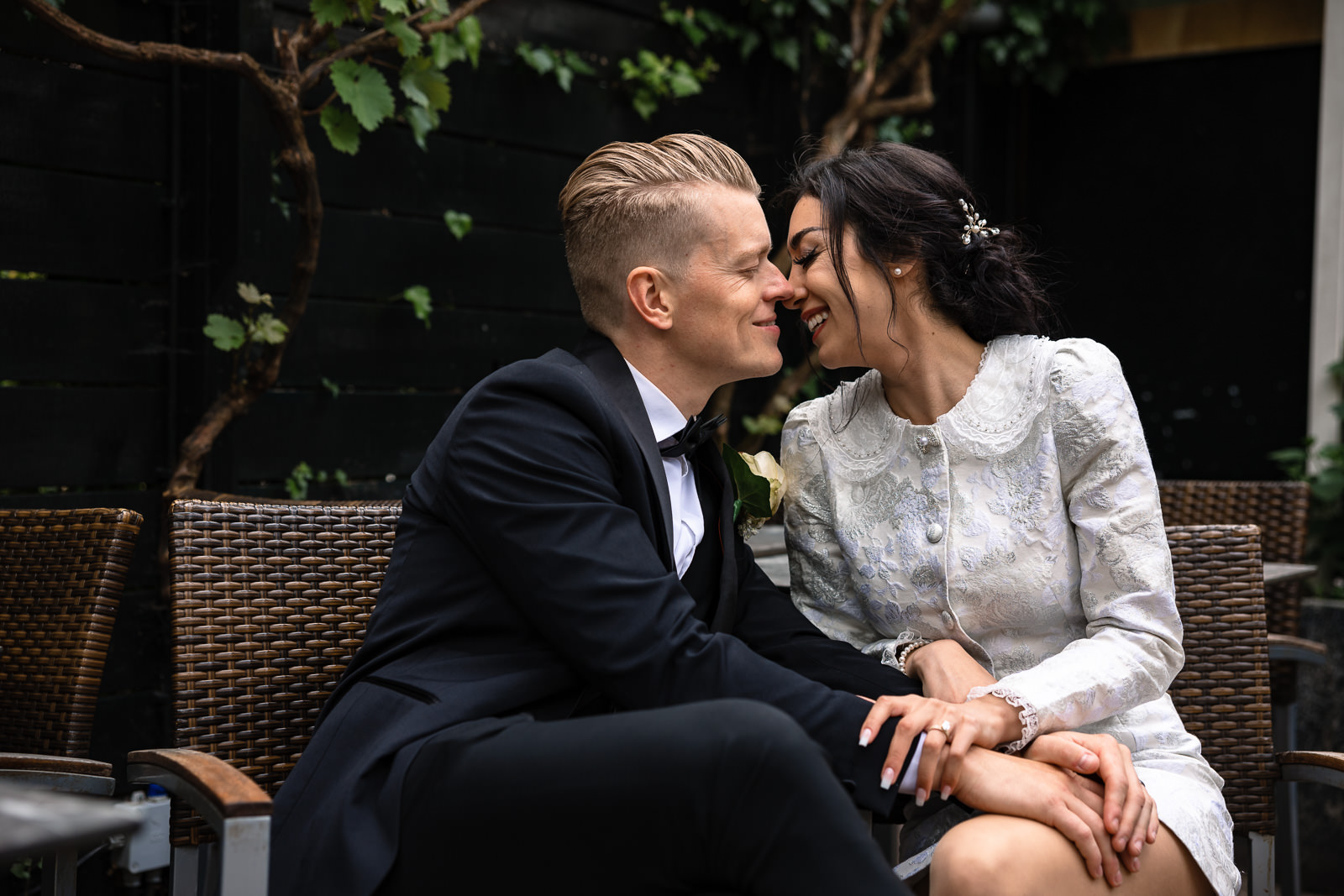 bride and groom snuggling up at a cafe Wedding photographer The Hague 