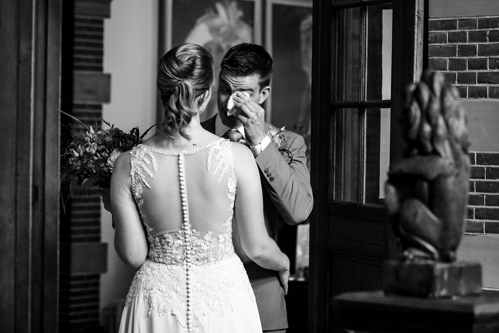 Firstlook bride and groom crying by wedding photographer The Hague