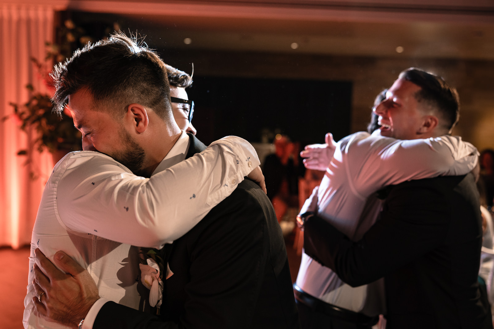 Hugs after wedding speeches during dinner